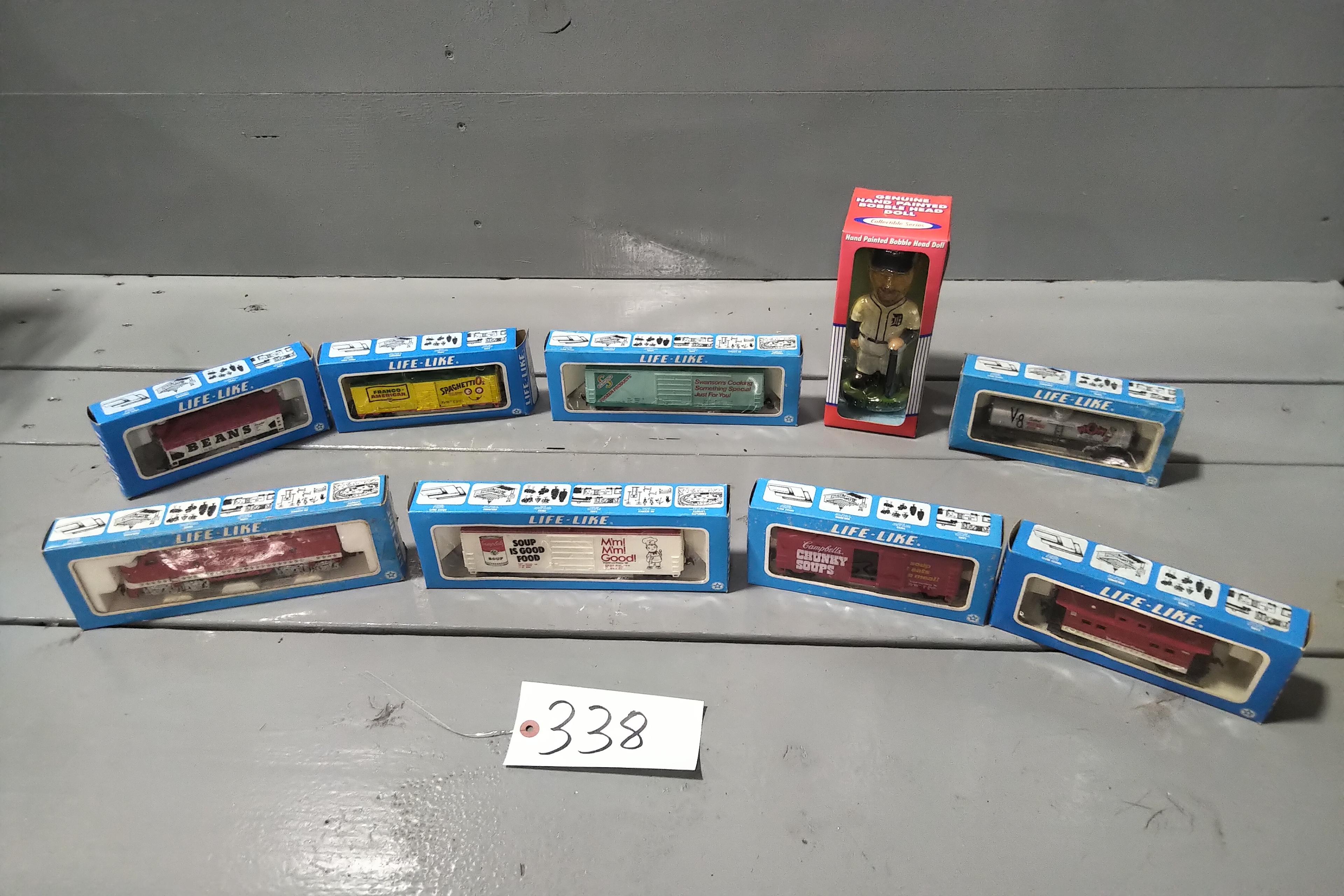 BOBLE HEAD OF BOBBY HIGGINSON, 8 - 1/64 SCALE RAIL CARS IN BOXES, 19 SIGNED BASEBALLS