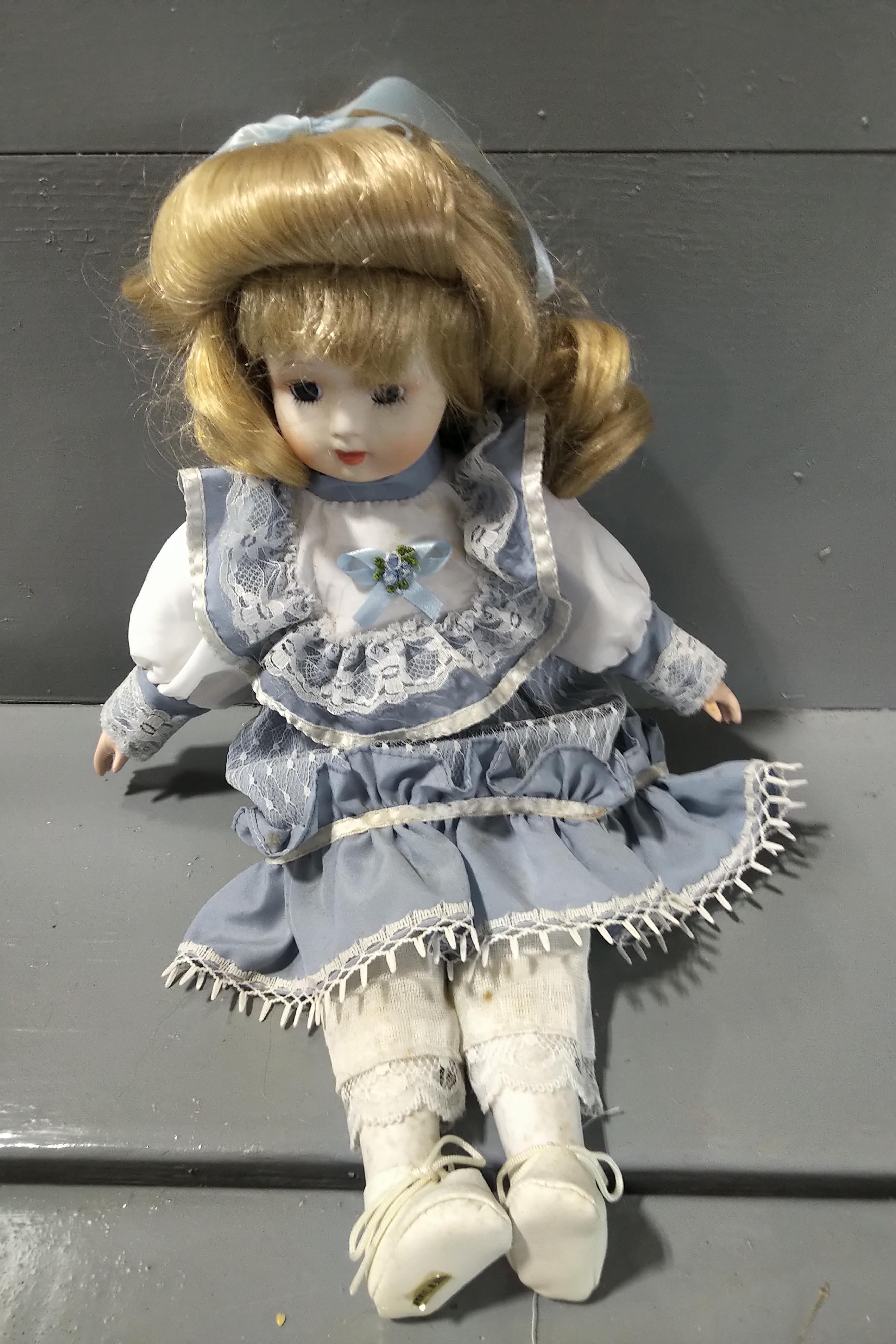 7 PORCELAIN DOLLS