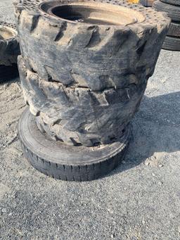 Assortment of Skid Steer and Truck Tires and Wheels