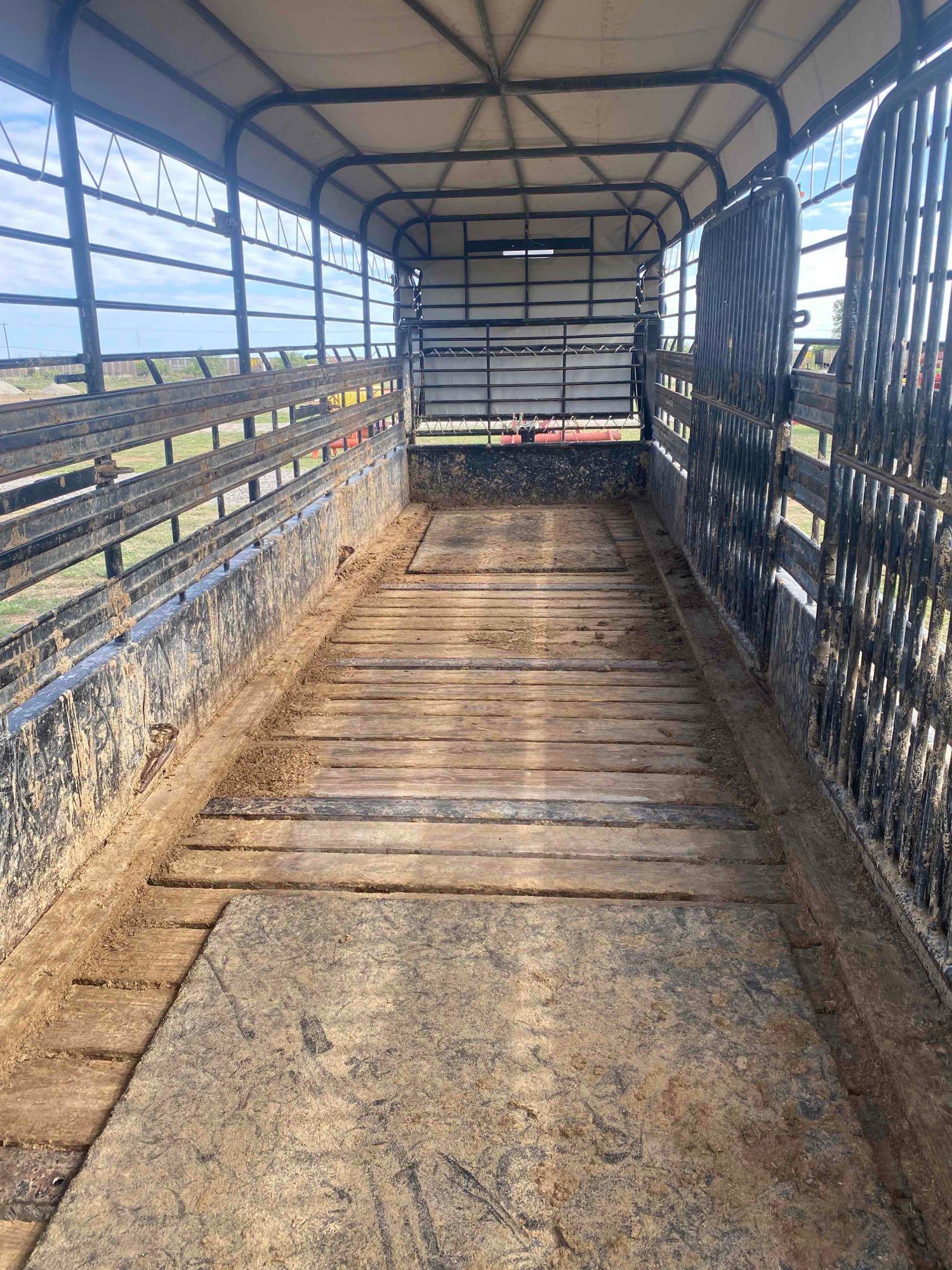 2021 24' x 6' Gooseneck Cattle Trailer, has 2... 8' Cuts, tandem axle, tires in good shape, tarp is 