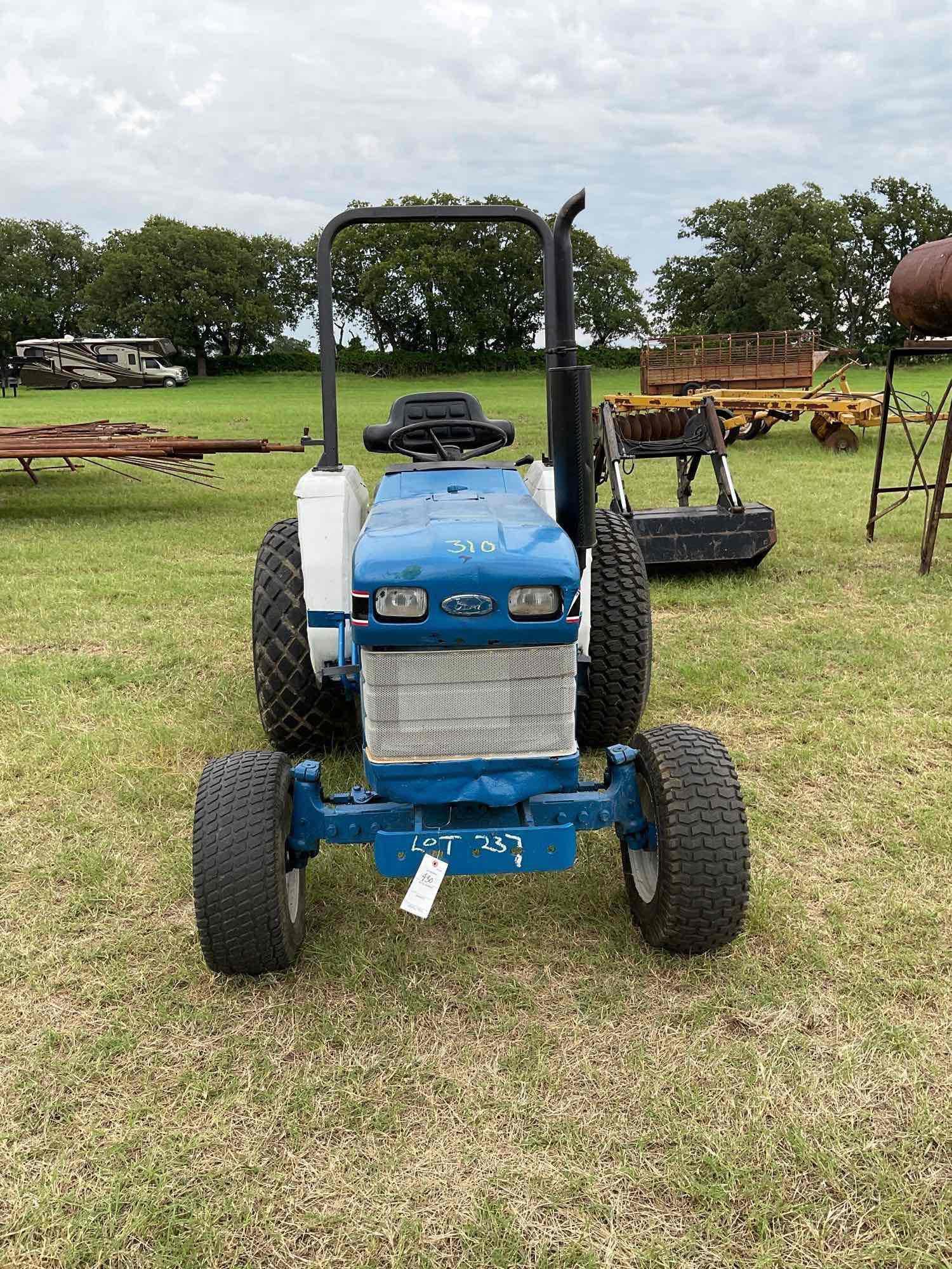 FORD 1520 WITH LOADER DIESEL 2 WHEEL DRIVE BUCKET WITH LOADER TURF TIRES ON THE TRACTOR REAR WEIGHTS