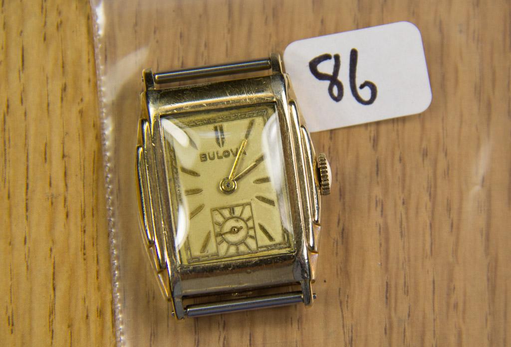 Bulova wristwatch stepped case- worn through at high points. Runs