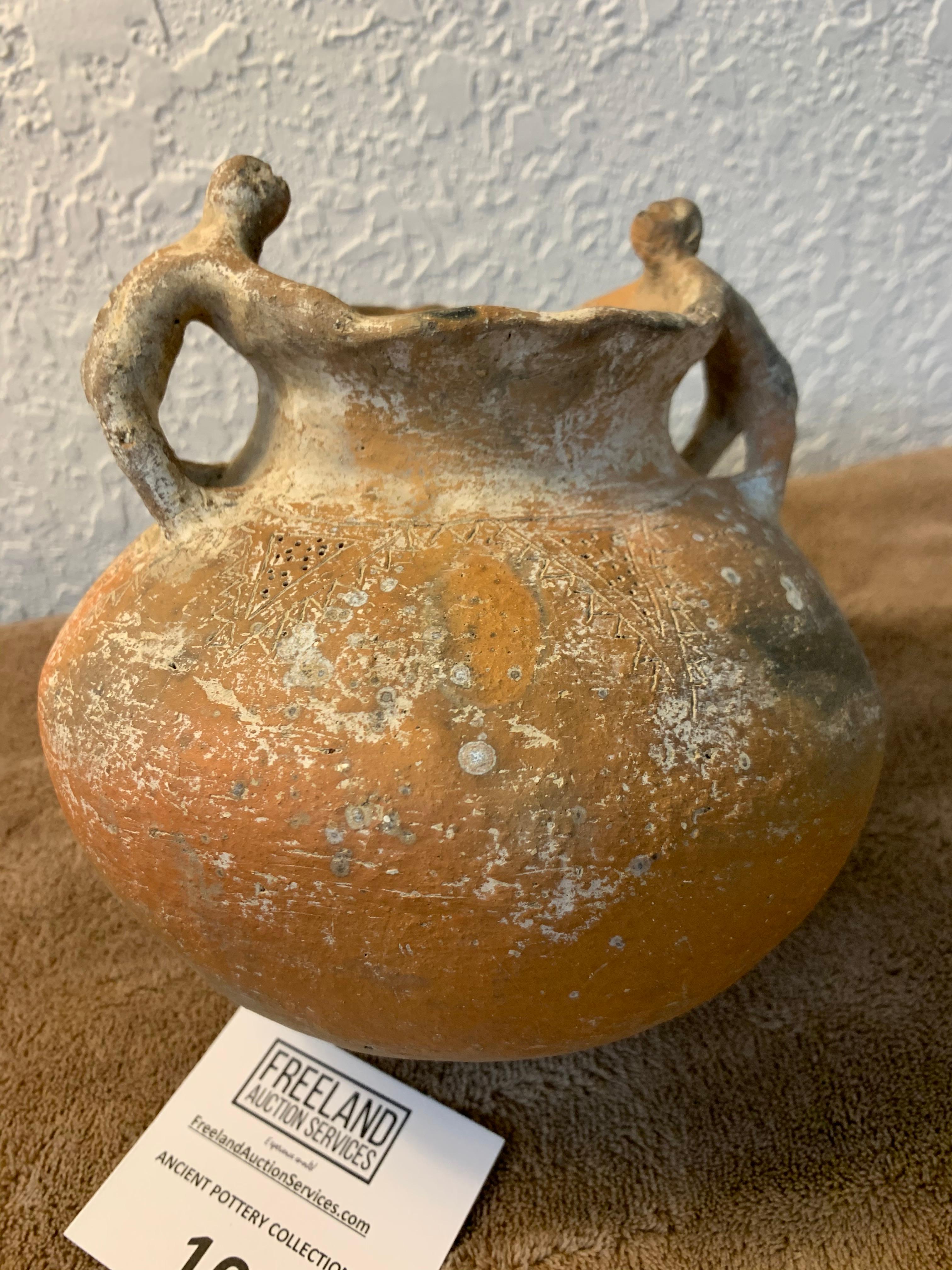 Unique Pottery Vessel With Human Figures On Handles