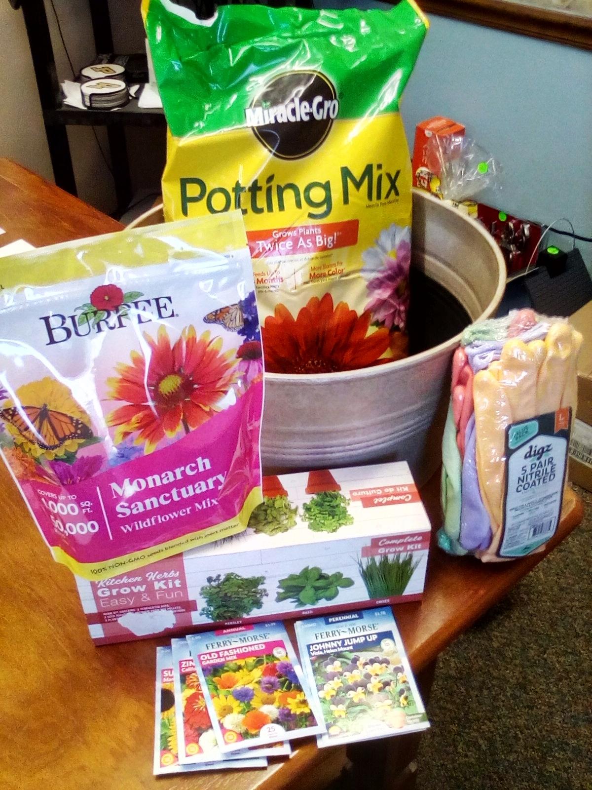 Gardening Planter full of potting soil, herb kits, flower seeds, and more