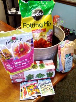 Gardening Planter full of potting soil, herb kits, flower seeds, and more