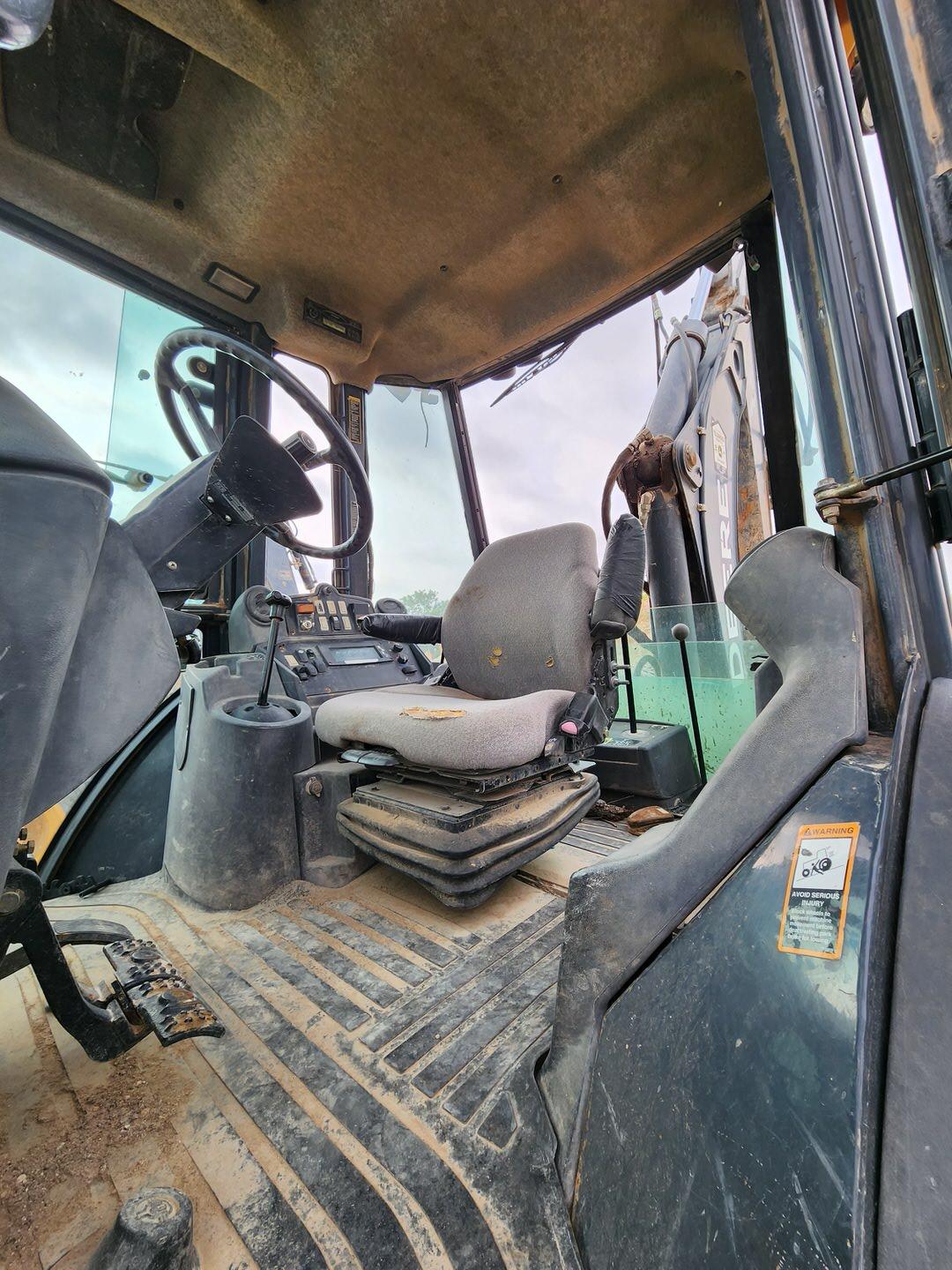 2007 John Deere 410J Backhoe Loader W/ 1.5 cu/yd Bucket & W/ Self Aligning Rolle