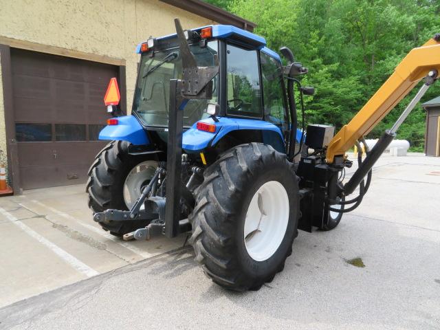 New Holland TS110 Tractor w/Alamo boom mower