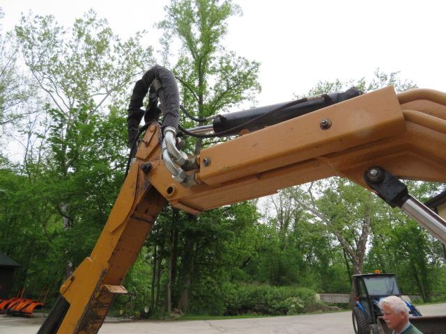 New Holland TS110 Tractor w/Alamo boom mower