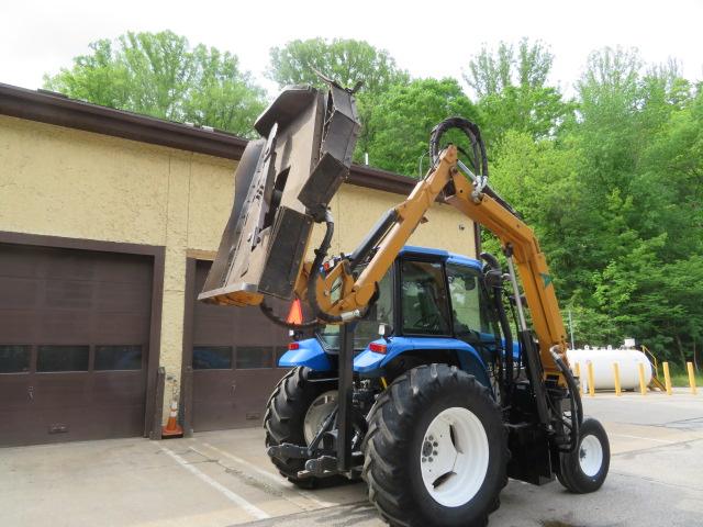 New Holland TS110 Tractor w/Alamo boom mower