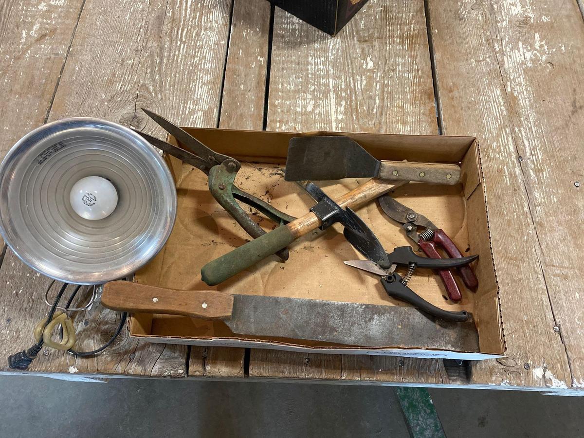Heat lamp, Corn knife and garden tools