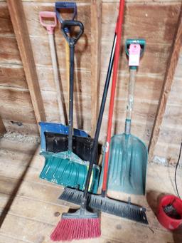 Assorted shovels and brooms.