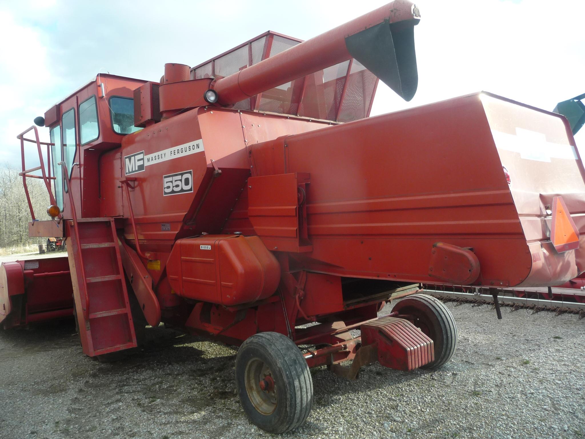 MF 550 diesel combine w/1144 4RW corn head, 2950 hrs, gear drive, 18.4x26