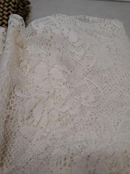 Lace curtain and woven afghan