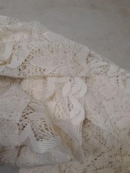 Lace curtain and woven afghan