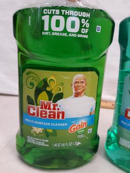 Two bottles Mr Clean multi surface cleaner, one with Gain, one with Fabreze