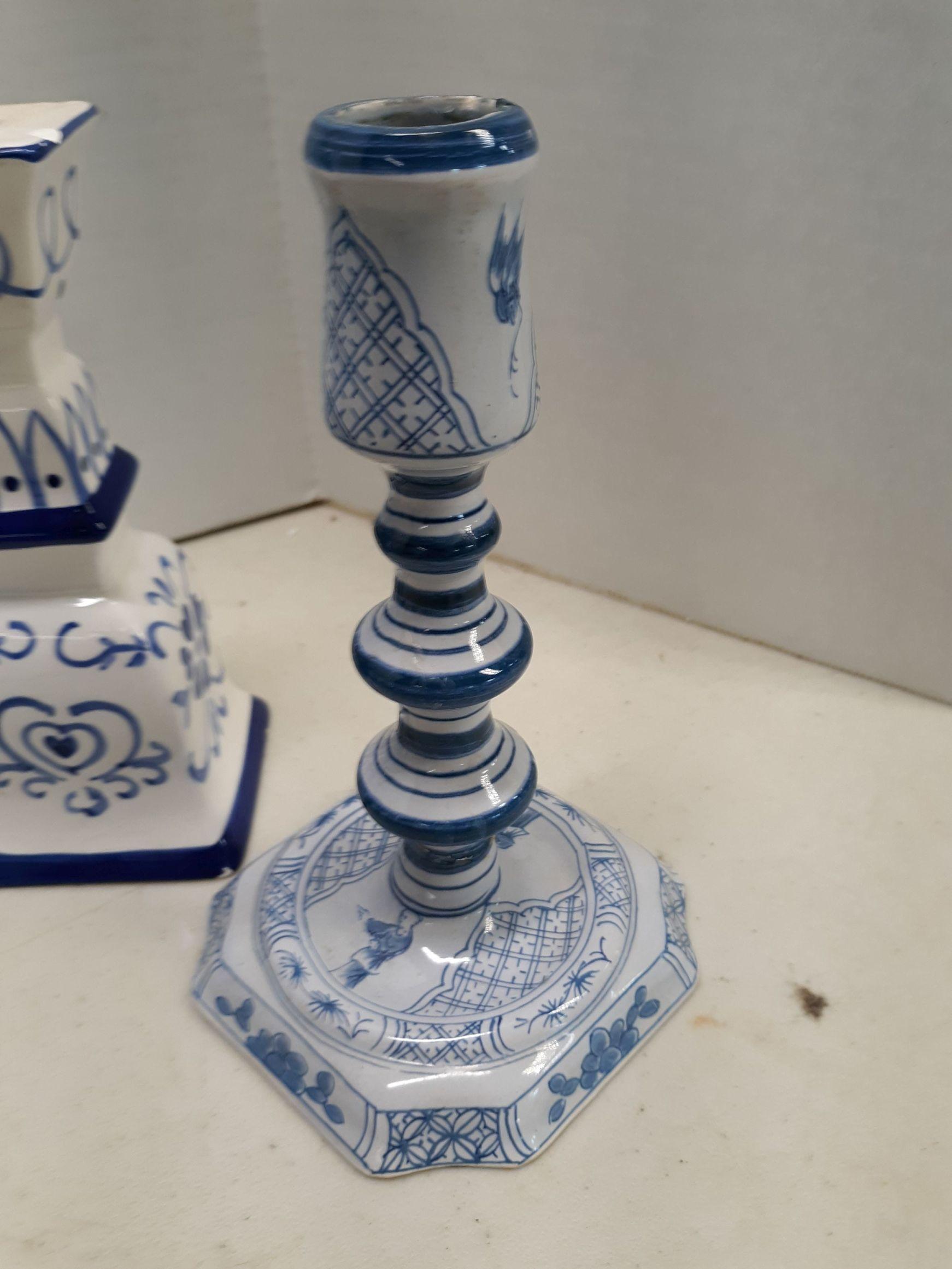 Blue and white ceramic candle sticks, lidded urn, two blue glass tall vases, martini glass