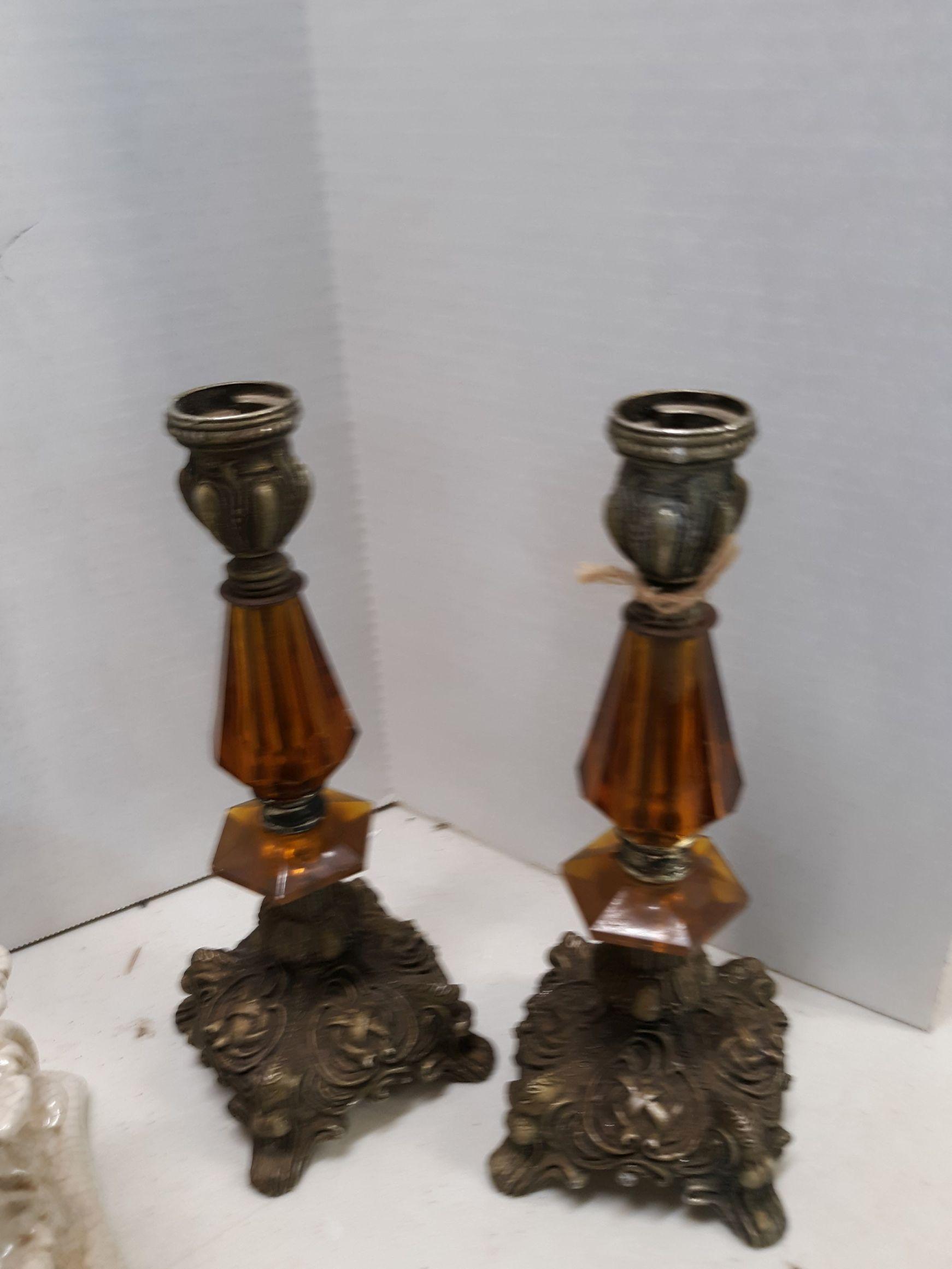 two candlesticks, pillar holder, two framed images of vegetables