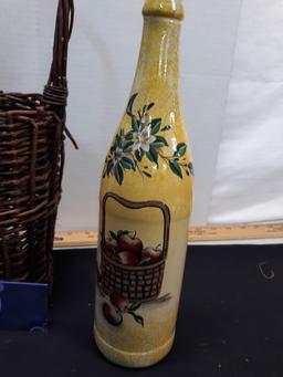 handpainted wine bottle in wicker holder