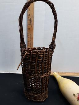 handpainted wine bottle in wicker holder