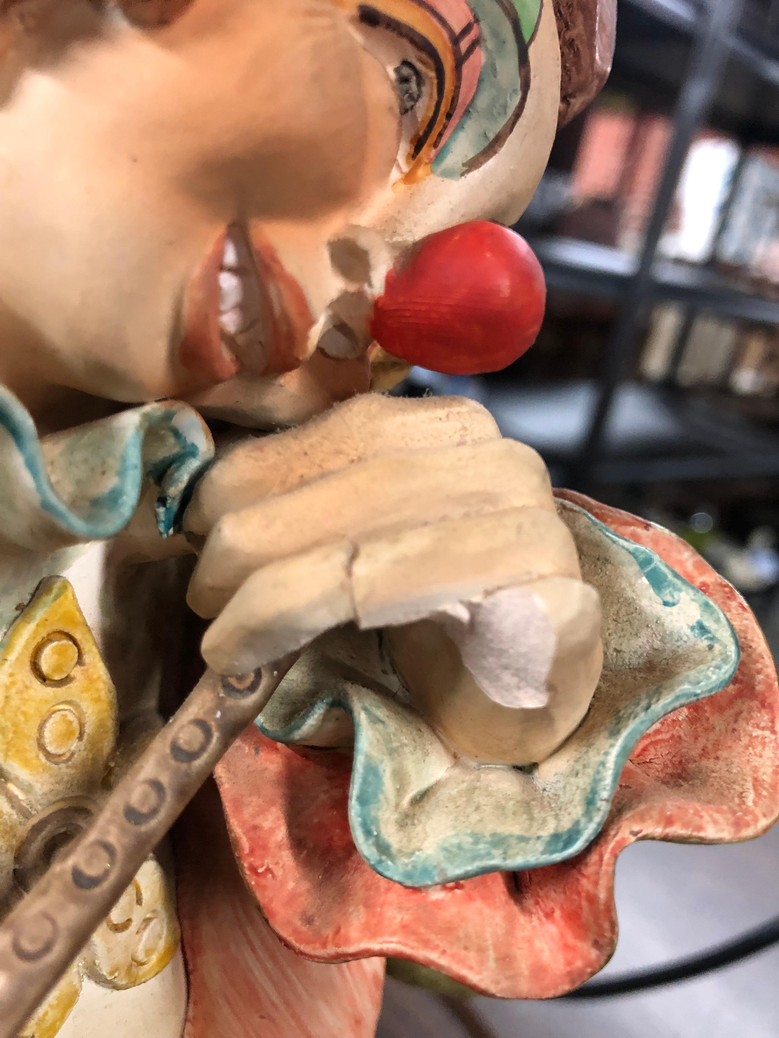 Two handpainted ceramic clown figurines, Made in Columbia, some damage, handpainted heavy clown