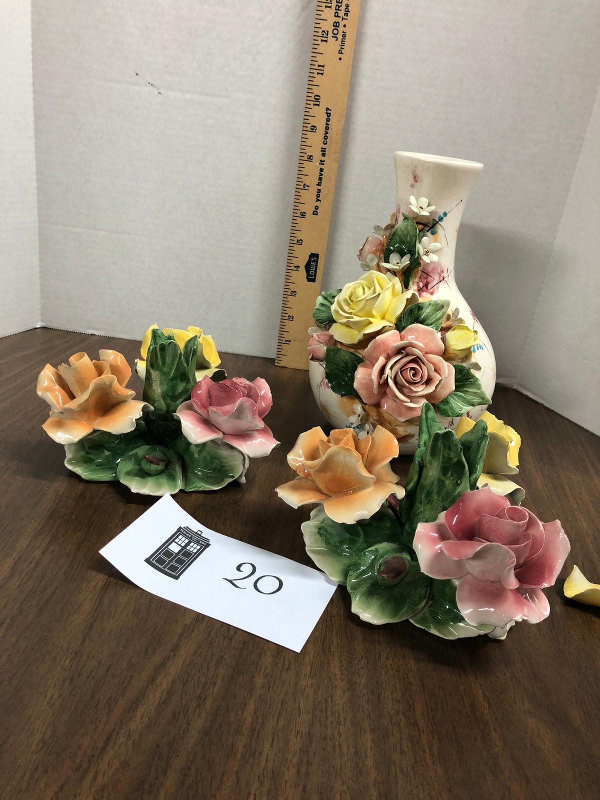 Three capodimonte pieces, two candle holders, one vase, some petal damage