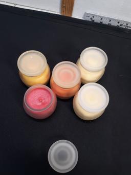 Candles in glass and ceramic containers