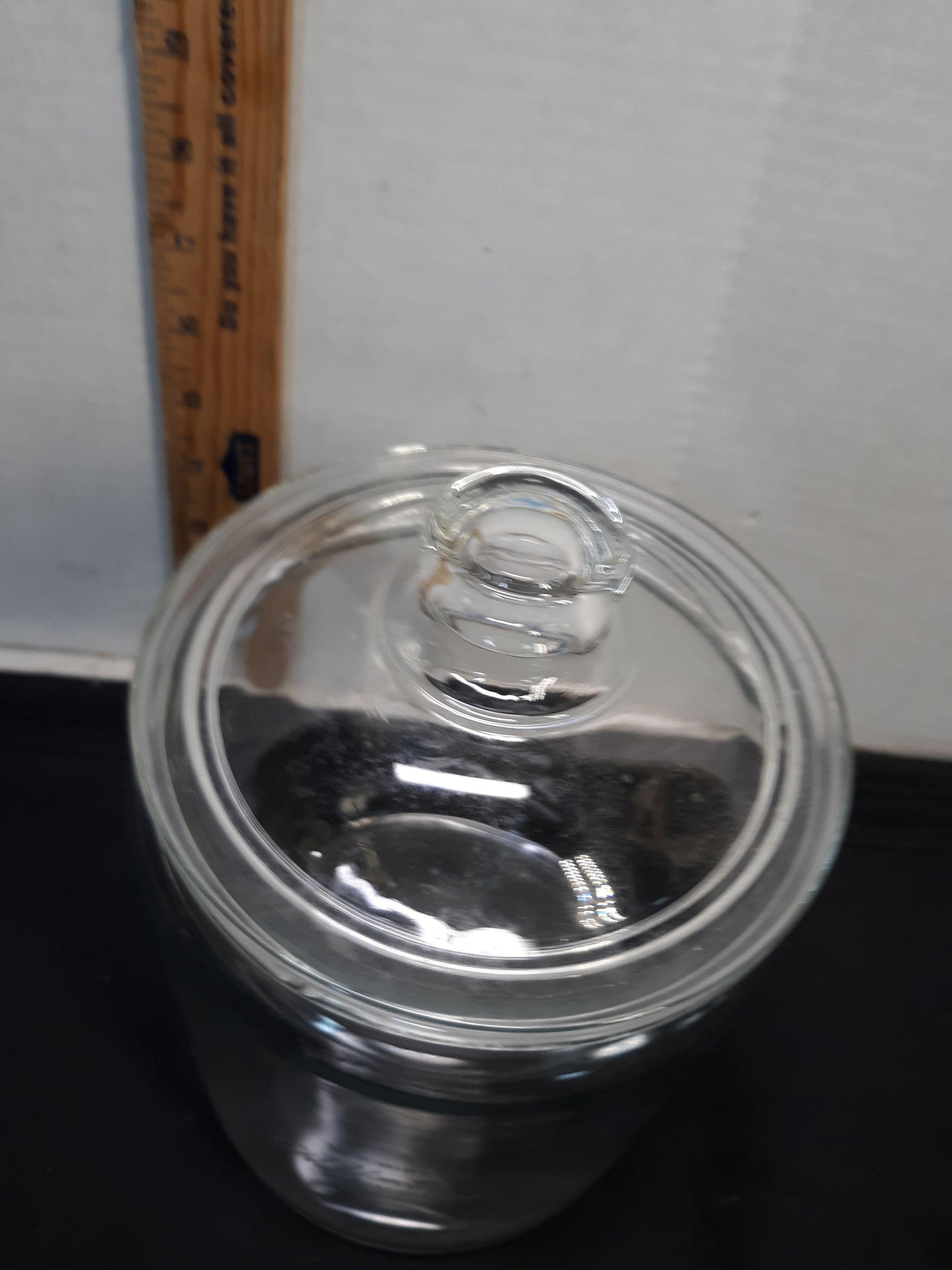 Glass Canister, Wachovia, has a couple of bites on the top