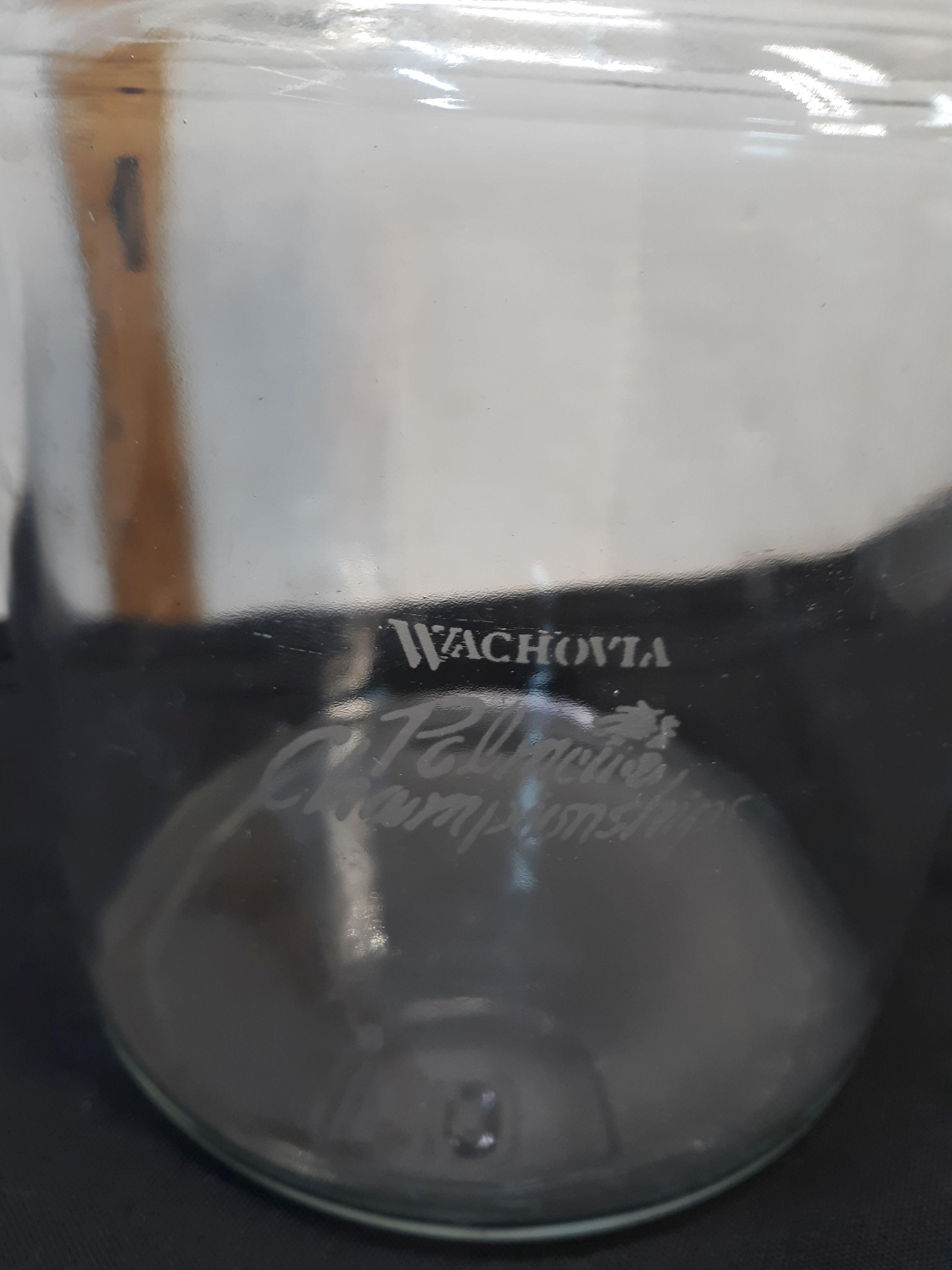 Glass Canister, Wachovia, has a couple of bites on the top