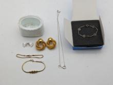 Mixed lot of Avon Jewelry in an avon decorative container