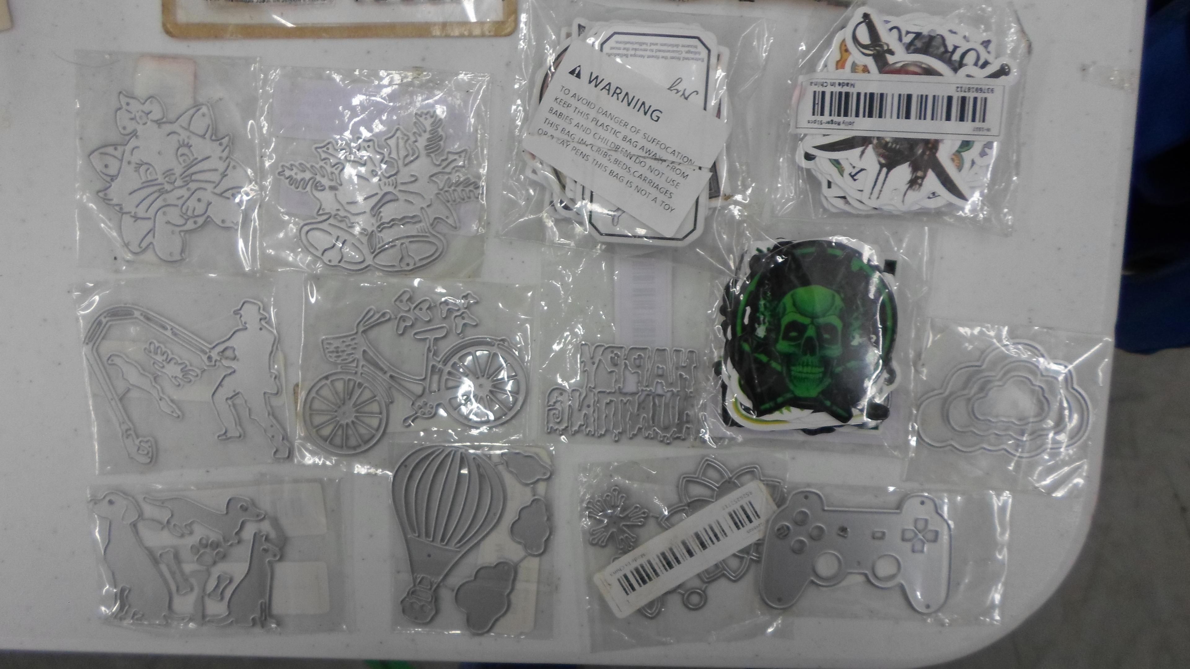 arts and crafting items, gallon bag full of new metal stenciles, iron ons, stickers, and much more