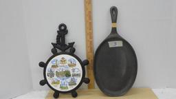 cast iron kitchen items, Hamburg Germany trivet and a oval skillet like new