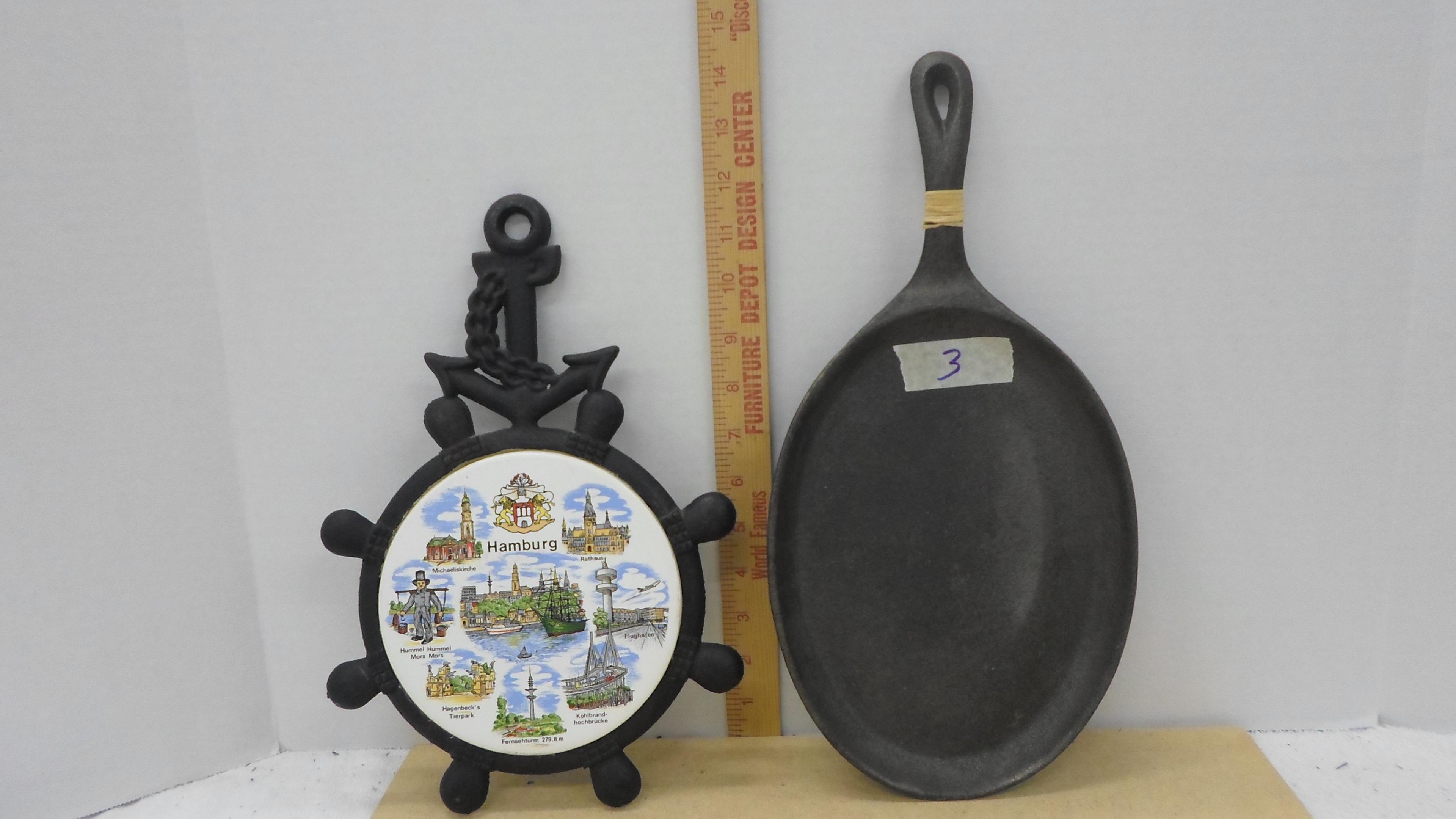 cast iron kitchen items, Hamburg Germany trivet and a oval skillet like new