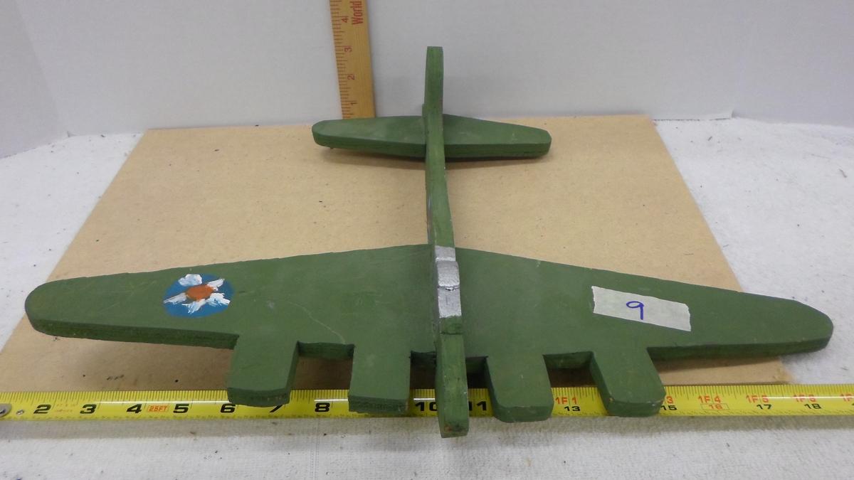wooden airplane, hand made and painted fashioned after a ww2 bomber