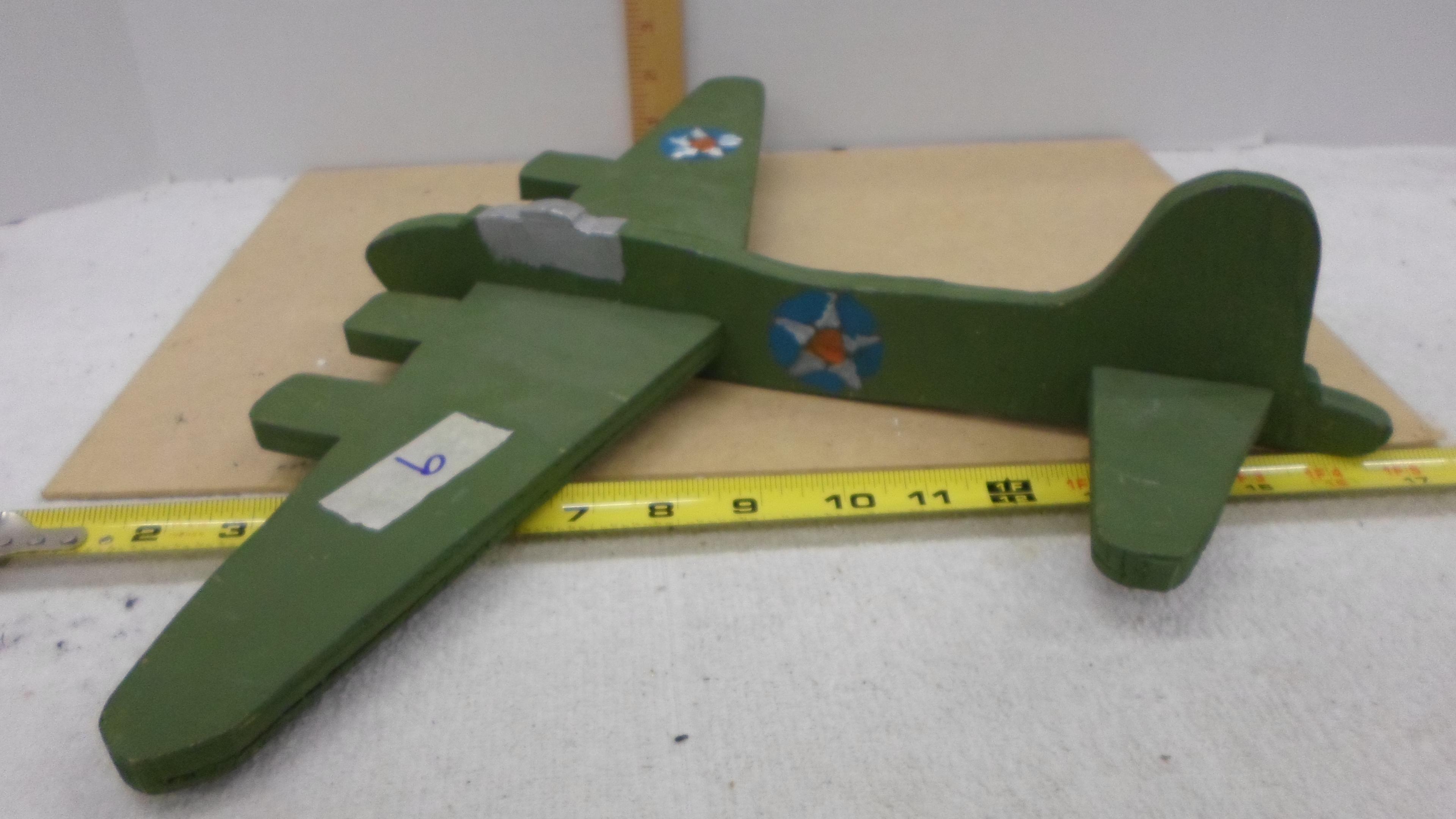 wooden airplane, hand made and painted fashioned after a ww2 bomber