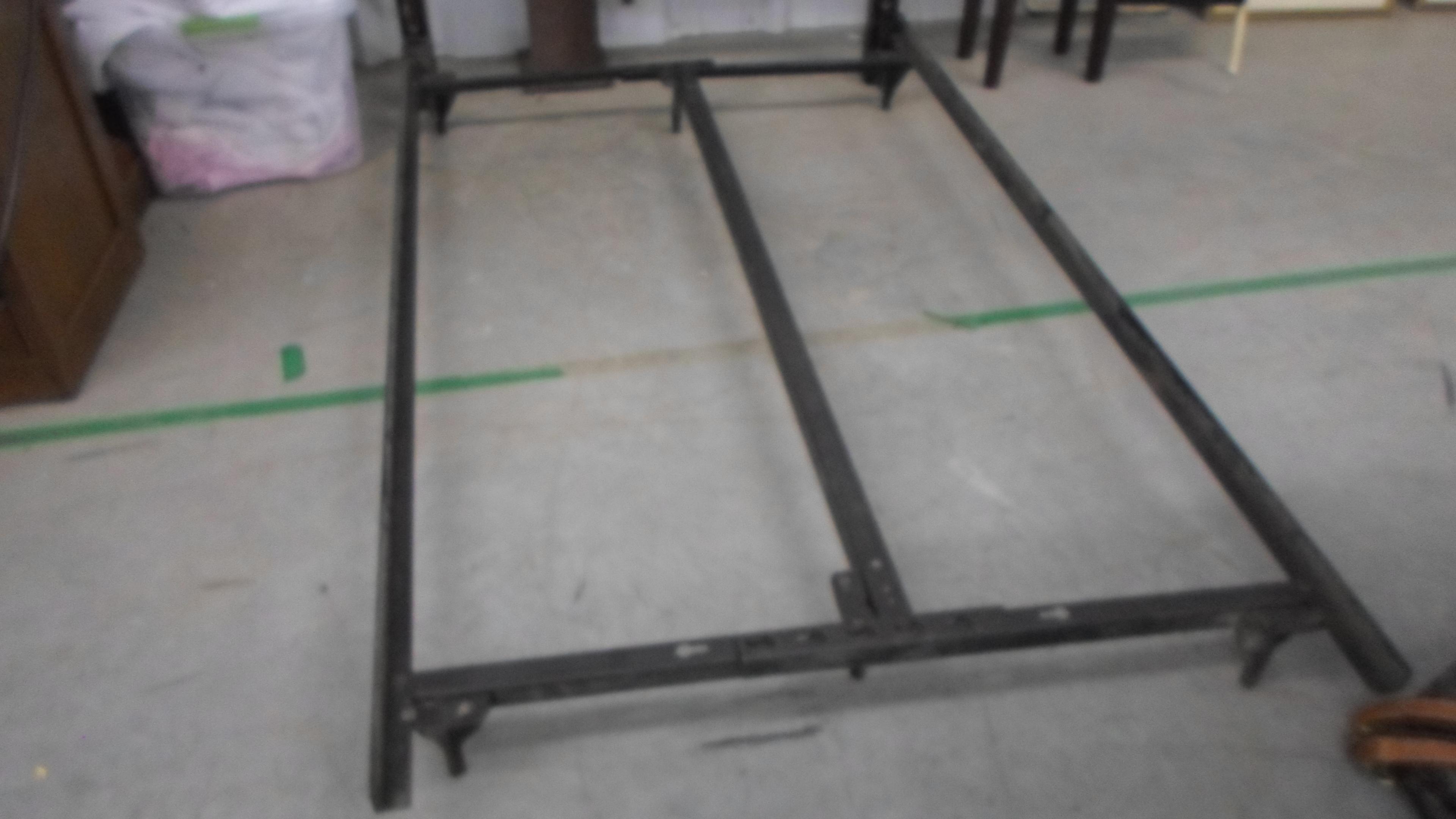 twin bed, metal frame can go up to full size with a twin head board