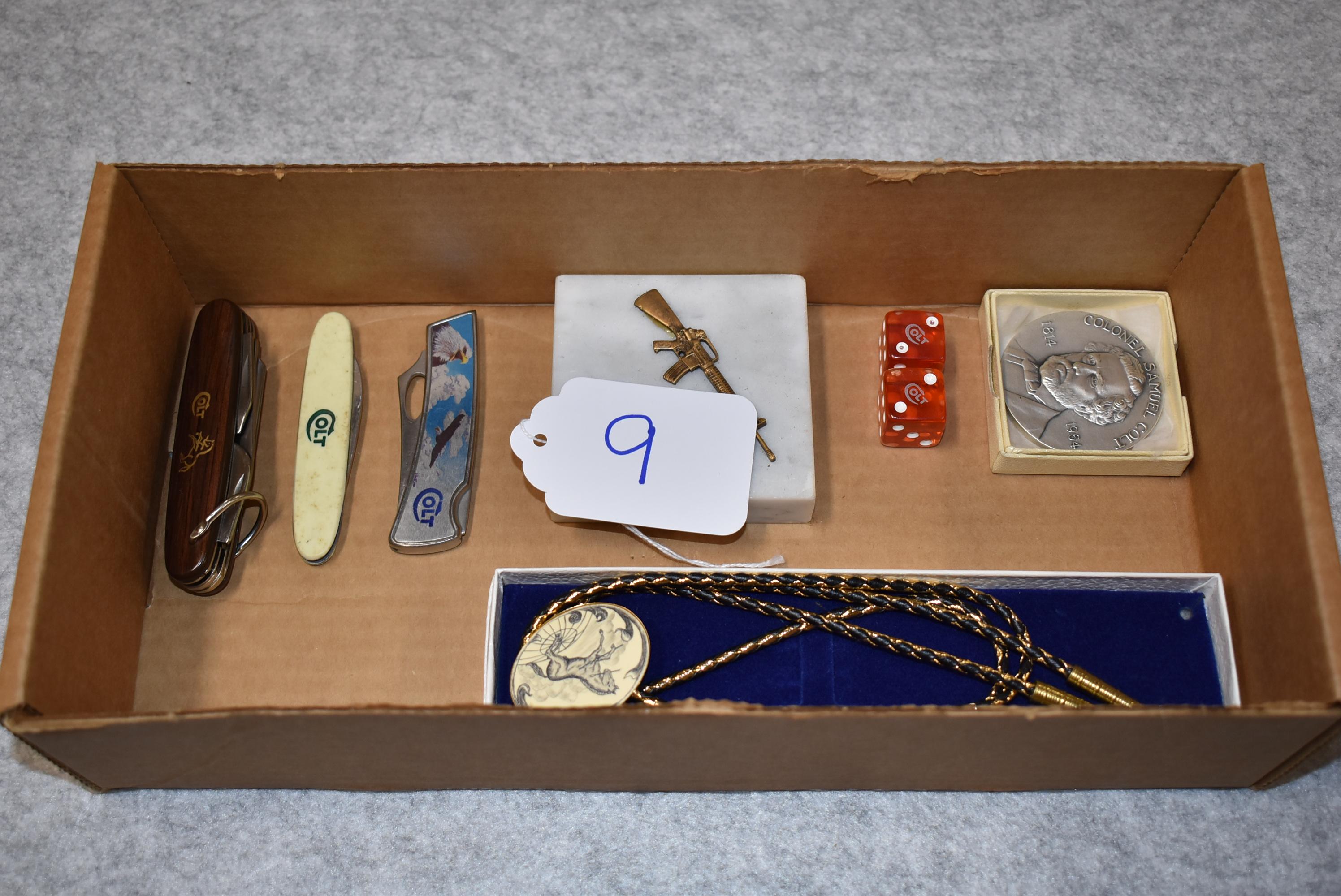 Lot of 7 Various Colt Collector Items – Including Knives, Colt AR-15 Paper Weight, Bolo Tie, Dice &