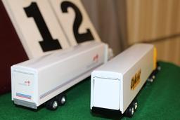 (2) 1/64 FREIGHTLINER SEMIS WITH TRAILERS,