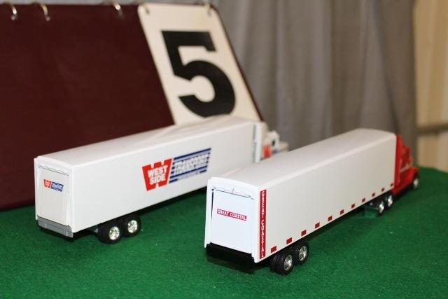 (2) 1/64 FREIGHTLINER SEMIS AND TRAILERS,