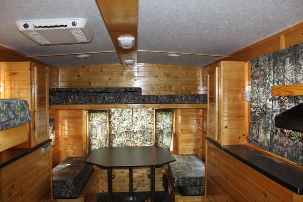 ***2013 AMERICAN SURPLUS ICE CASTLE 8' X 16' LAKE OF THE WOODS FISH HOUSE. SINGLE AXLE CRANK DOWN