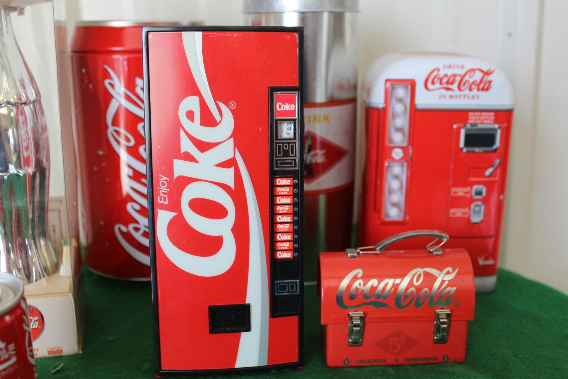 (8) Coca Cola memorabilia pieces, cans, bottles