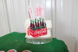 Assorted Coca Cola pieces, straw and napkin holder, yoyo's, lunchbox, jewel