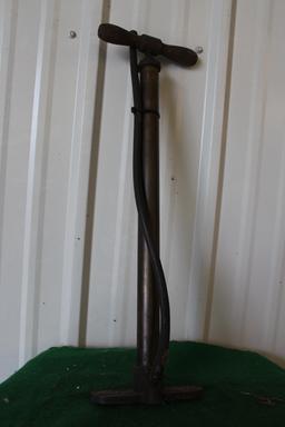 Vintage air pump, hose is slightly frayed by base