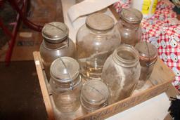 Antique glass jars, some with glass lids