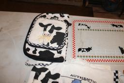 Cow cutting board, hand towels and wood basket