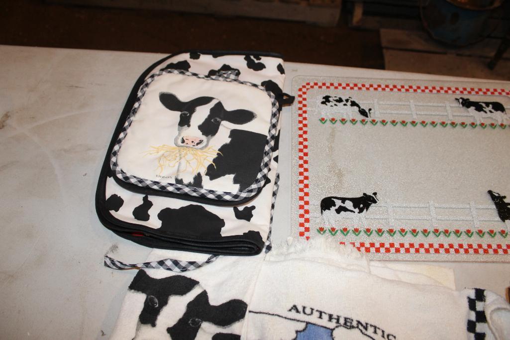 Cow cutting board, hand towels and wood basket