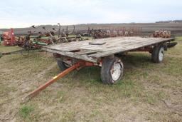 8'X16' FLAT BED WITH HUSKEE 4 WHEEL RUNNING GEAR, 15" FLOATATION TIRES, DECK NEEDS SOME REPAIR