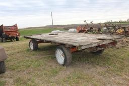 8'X16' FLAT BED WITH HUSKEE 4 WHEEL RUNNING GEAR, 15" FLOATATION TIRES, DECK NEEDS SOME REPAIR