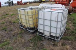 (2) 250 GALLON POLY TOTES IN STEEL CAGES, HOLES IN TOTES