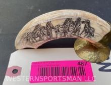 Hippo tusk / ivory,-scrimshaw of a herd of Zebras , on a brass display, tusk is 6 inches long on a 7