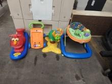 LOT OF 4 KIDS RIDE ON AND WALKING TOYS